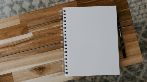Photo of blank notepad depicting writer's block