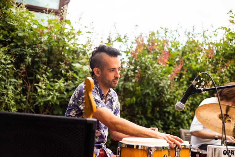 Photo of Giorgio Cortiana playing percussion in a live setting