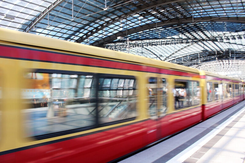 Photo of a moving train in a Berlin train station