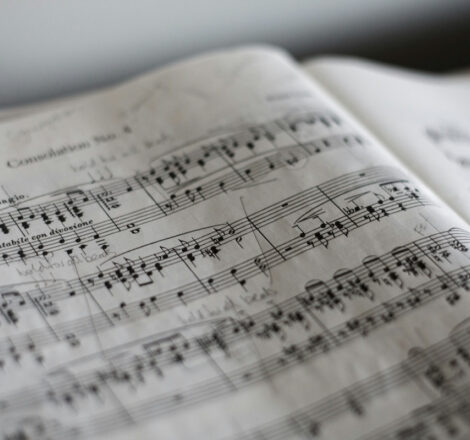 Photo of a book of sheet music depicting music theory