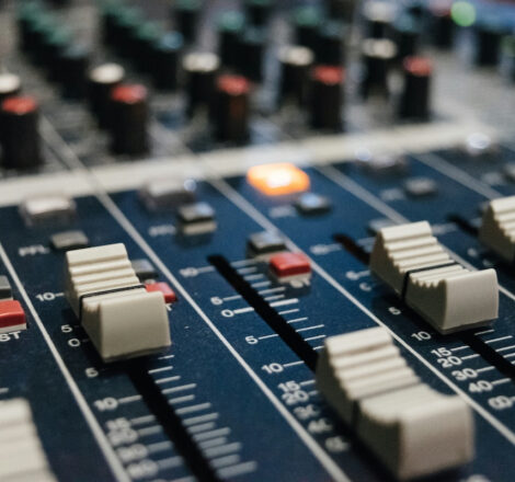 Photo of mixing console depicting audio stems