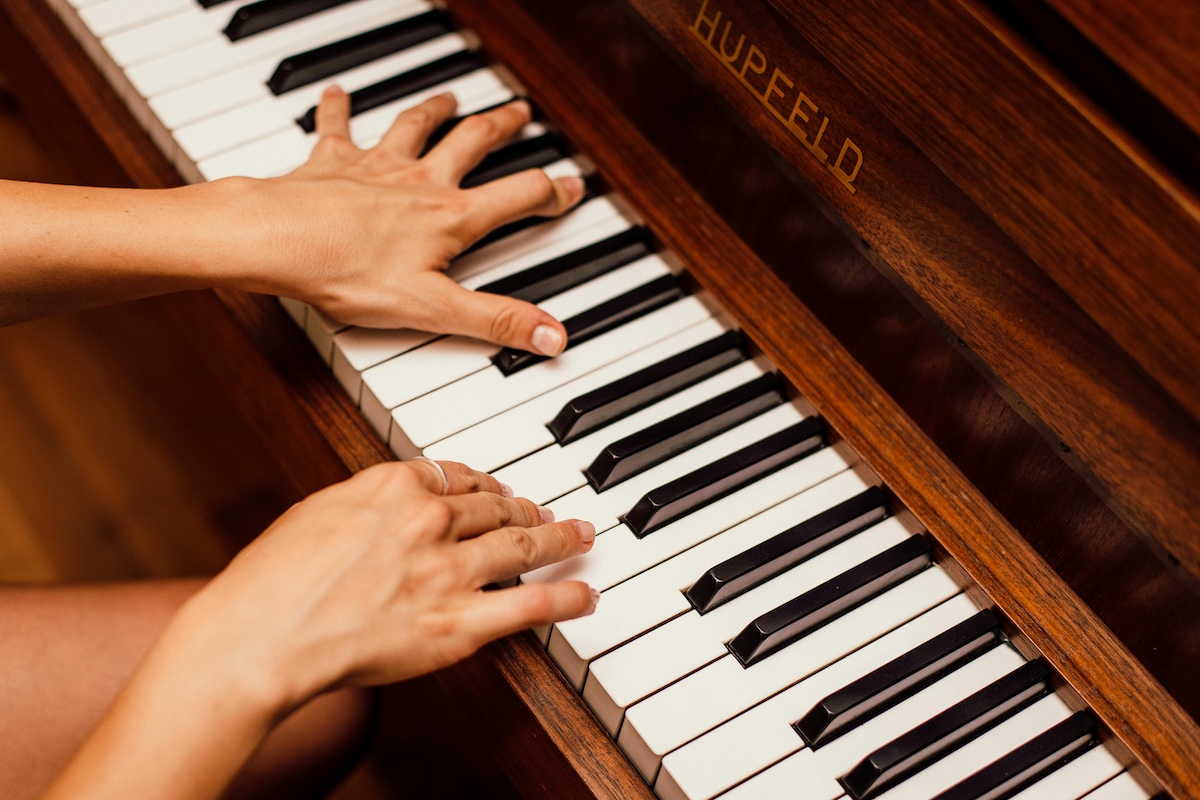 ZP016_music_theory_chords Someone playing chords on a piano